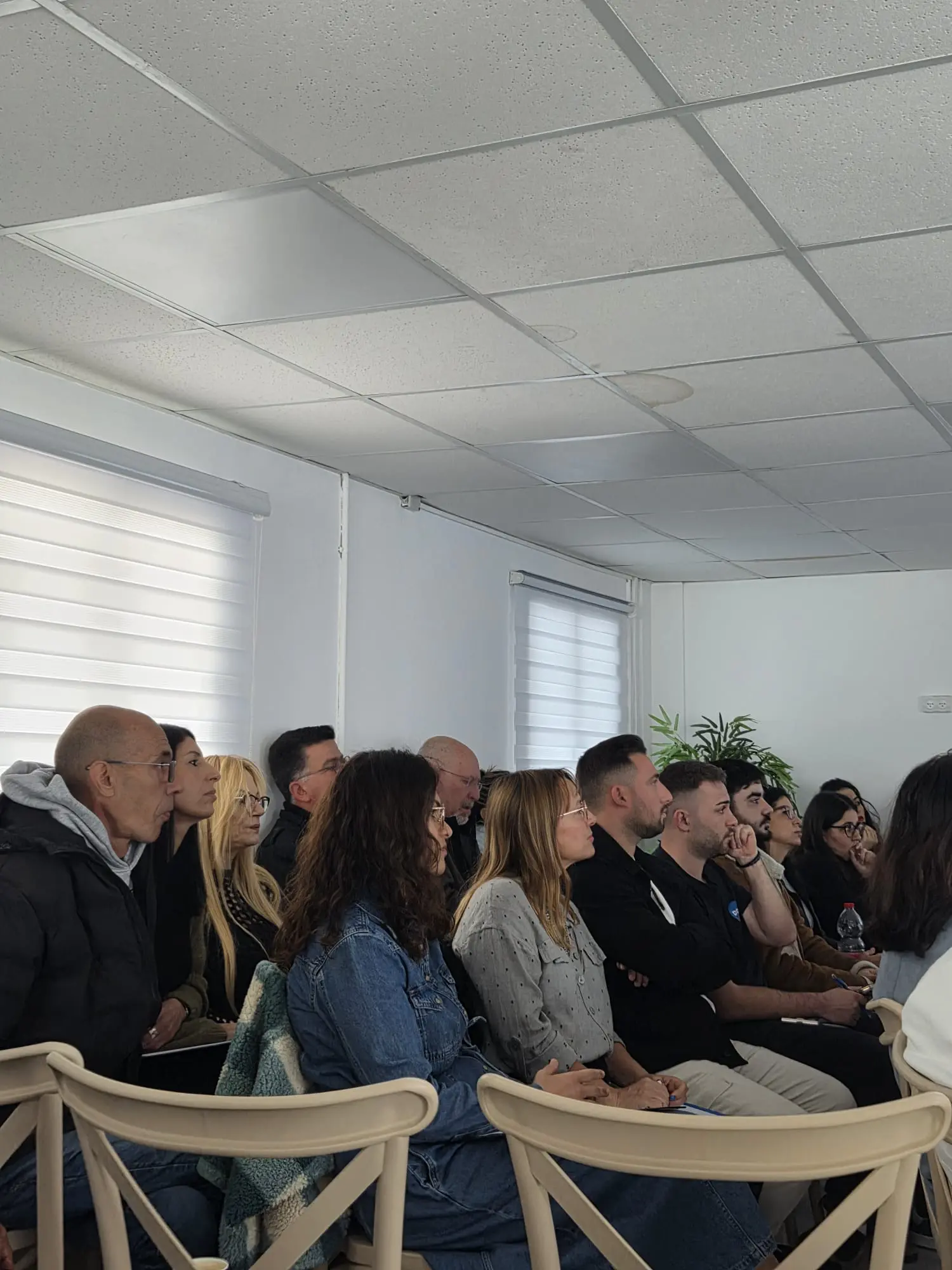 Participants listening during a lecture